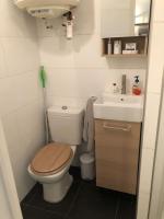 a small bathroom with a toilet and a sink at Cosy studio situé en plein cœur du vieil antibes. in Antibes