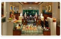 a store filled with lots of different types of food at Peerless Hotel Kolkata in Kolkata