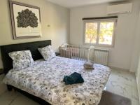 Posteľ alebo postele v izbe v ubytovaní 3 Pièces climatisé en rez de jardin avec piscine