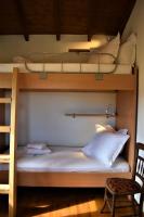 A bed or beds in a room at Dolichi House