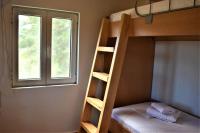 A bed or beds in a room at Dolichi House