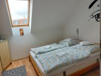 Łóżko lub łóżka w pokoju w obiekcie Apartmancentrum