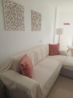 A bed or beds in a room at Primera linea de Playa a 10 min Estepona