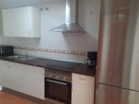 A kitchen or kitchenette at Primera linea de Playa a 10 min Estepona