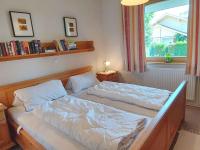 a bedroom with two beds and a window at Holiday home in Bad Mitterndorf - Steiermark 41114 in Bad Mitterndorf