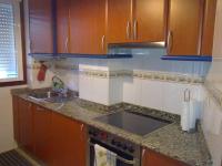 A kitchen or kitchenette at Piso acogedor con Parking