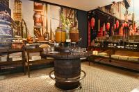 een kamer met een tafel met glazen erop bij Heritage Luxury Suites All Suite Hotel in Lahore