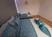 Łóżko lub łóżka w pokoju w obiekcie Villa avec plage à pied et grande piscine