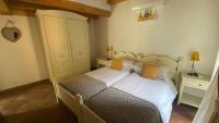 A bed or beds in a room at Il Mulino di Hotel Villa Aurora