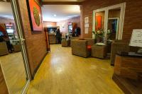 a lobby of a restaurant with tables and chairs at Sole Hotel in Antananarivo
