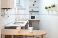 A kitchen or kitchenette at Apartamentos Catedral Plaza 3000
