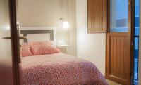 A bed or beds in a room at Apartamentos Catedral Plaza 3000