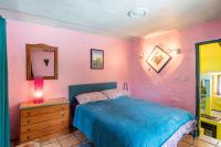 A bed or beds in a room at El Nido holiday cottage with pool
