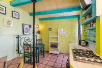 A kitchen or kitchenette at El Nido holiday cottage with pool
