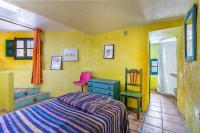 A bed or beds in a room at El Nido holiday cottage with pool