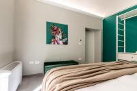 A bed or beds in a room at Ortigia's Queen