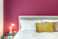 A bed or beds in a room at Ortigia's Queen