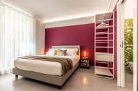 A bed or beds in a room at Ortigia's Queen