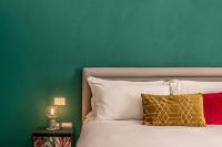 A bed or beds in a room at Ortigia's Queen