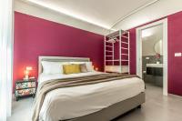 A bed or beds in a room at Ortigia's Queen
