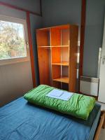 Łóżko lub łóżka w pokoju w obiekcie Camping Onlycamp Les Deux Rives