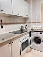 A kitchen or kitchenette at S2Plaza de la Merced especial grupos con parking
