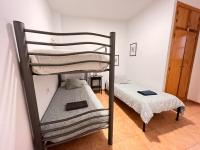 A bed or beds in a room at S2Plaza de la Merced especial grupos con parking
