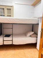 A bed or beds in a room at S2Plaza de la Merced especial grupos con parking