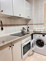 A kitchen or kitchenette at S2Plaza de la Merced especial grupos con parking