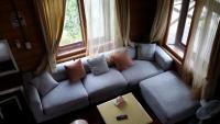 a living room with a couch with pillows on it at Summer Trail B&amp;B in Guangfu