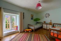 Posteľ alebo postele v izbe v ubytovaní Ty Fossac - Belle maison pour 6