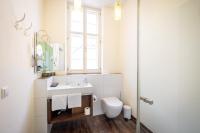 a bathroom with a sink and a toilet and a window at Altstadthof Freinsheim in Freinsheim