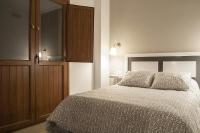 A bed or beds in a room at Apartamentos Catedral Plaza 3000