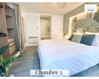 Posteľ alebo postele v izbe v ubytovaní Le 9 de Cœur - 2 chambres - 6 couchages