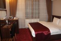 Postel nebo postele na pokoji v ubytování Resmina Hotel