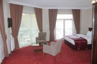 Postel nebo postele na pokoji v ubytování Resmina Hotel