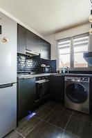 Kuchyňa alebo kuchynka v ubytovaní Appartement confortable proche Disneyland Paris