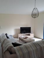 A television and/or entertainment centre at Déjà Blue