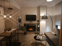Televízia a/alebo spoločenská miestnosť v ubytovaní Studio Miramar Suites Malaga