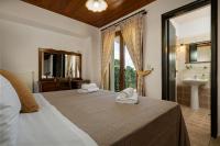 A bed or beds in a room at Villa Eleftheria private pool/garden/view/3bdrms/3.5bthrms