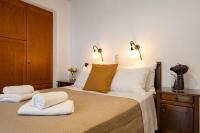 A bed or beds in a room at Villa Eleftheria private pool/garden/view/3bdrms/3.5bthrms