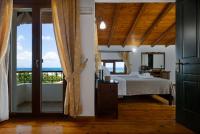 A bed or beds in a room at Villa Eleftheria private pool/garden/view/3bdrms/3.5bthrms
