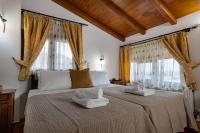 A bed or beds in a room at Villa Eleftheria private pool/garden/view/3bdrms/3.5bthrms