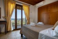 A bed or beds in a room at Villa Eleftheria private pool/garden/view/3bdrms/3.5bthrms