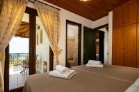 A bed or beds in a room at Villa Eleftheria private pool/garden/view/3bdrms/3.5bthrms