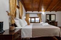 A bed or beds in a room at Villa Eleftheria private pool/garden/view/3bdrms/3.5bthrms