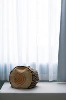 a wooden log sitting on a window sill at Beat Hotel Bangkok in Bangkok