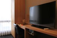 a large flat screen television sitting on a desk at Capital Hotel SongShan in Taipei