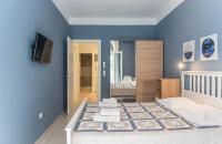 A bed or beds in a room at Speranza by halu! Apartment next to Efkleidis metro station