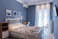 A bed or beds in a room at Speranza by halu! Apartment next to Efkleidis metro station
